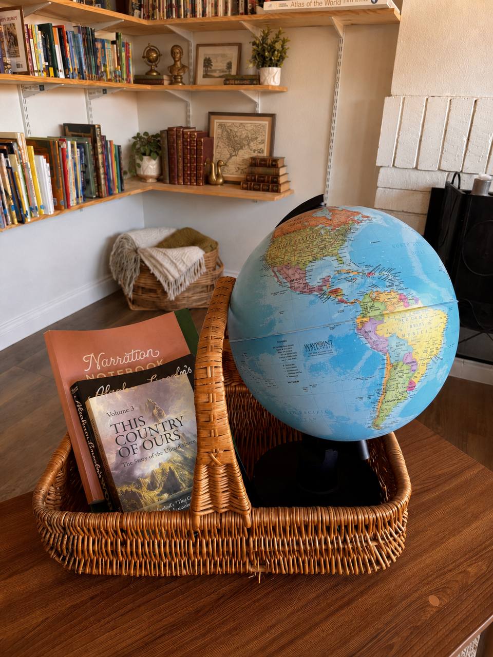 Grade 5 American history basket with living books, narration notebook, and globe